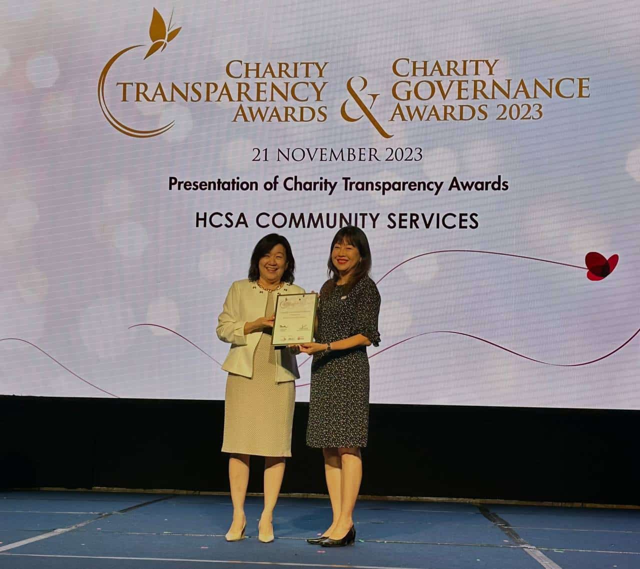 CEO Kim Lang Khalil, right, receiving the Charity Transparency Award